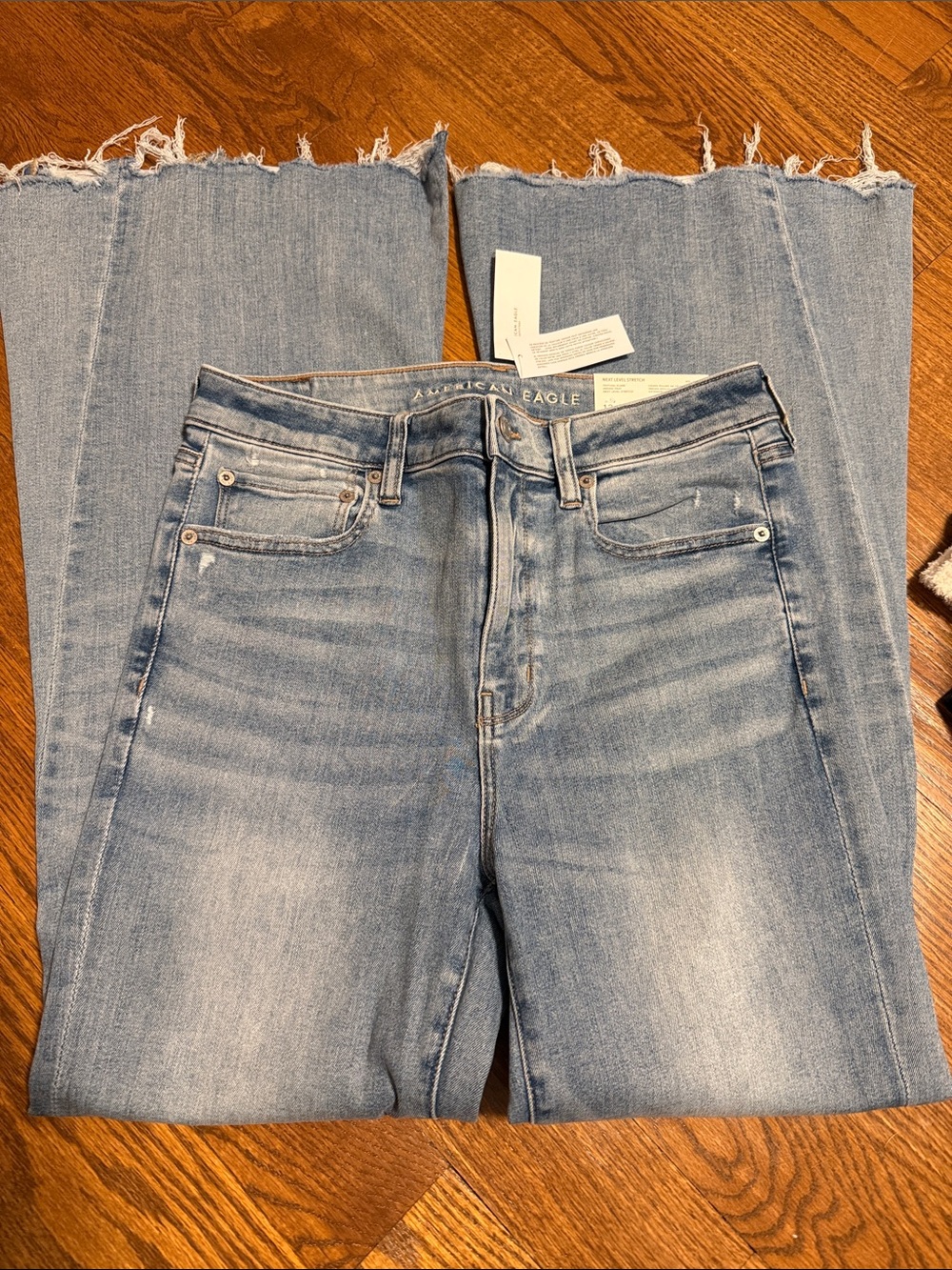 American Eagle Next Level Stretch Festival Flare high rise jeans 12 Indigo Fray